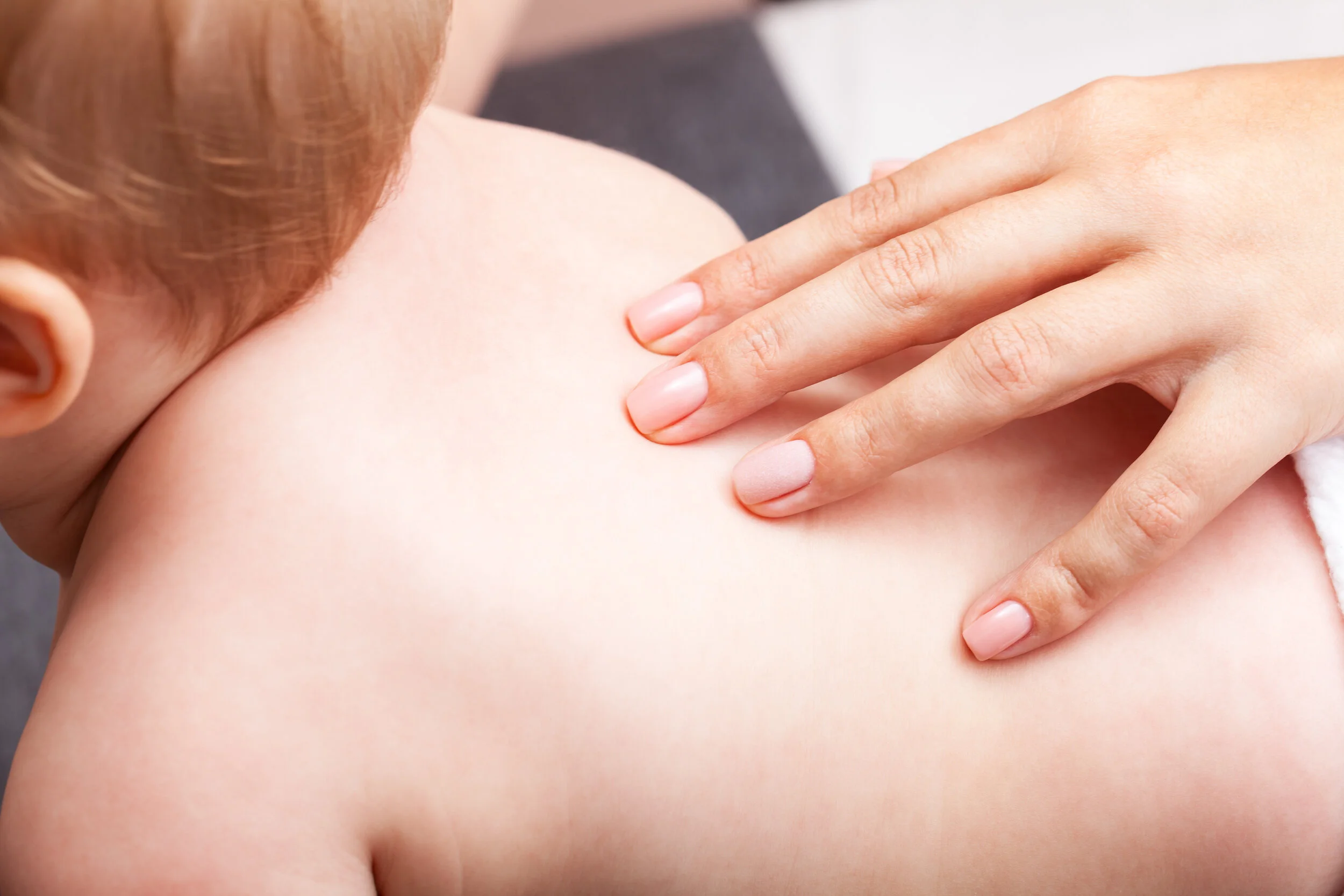 A parent and child at a chiropractic appointment